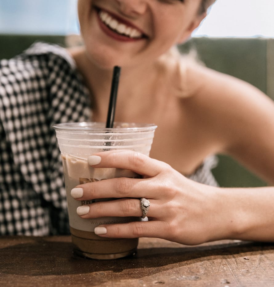 Photo of His and her hands with engagement rings